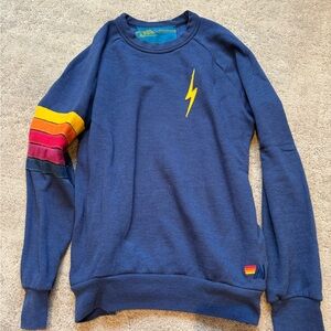 Blue aviator nation sweatshirt with strips on the side